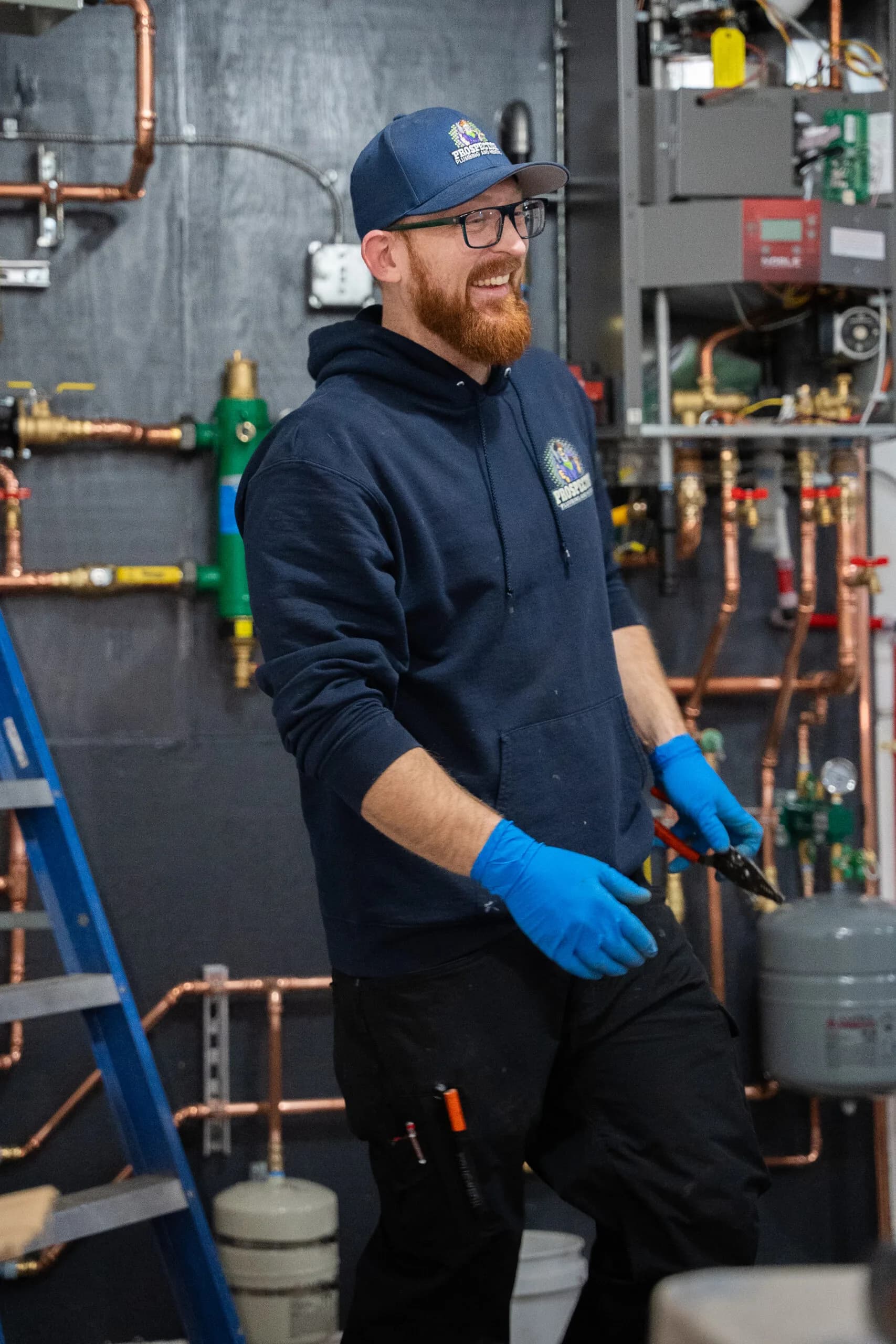 A Prospector plumber thawing a frozen water line